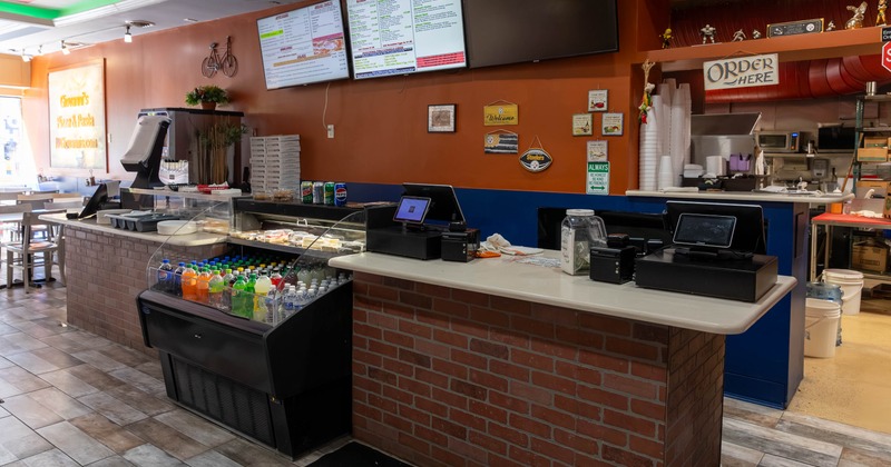 Restaurant counter area with menu boards above