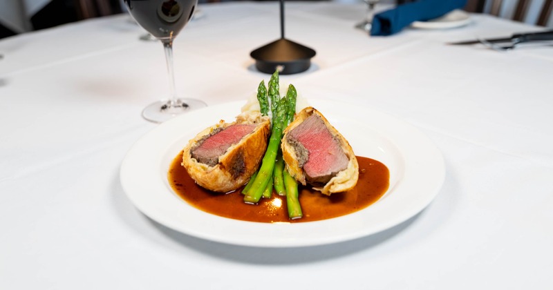 Beef Wellington served with potato puree, asparagus and rosemary sauce