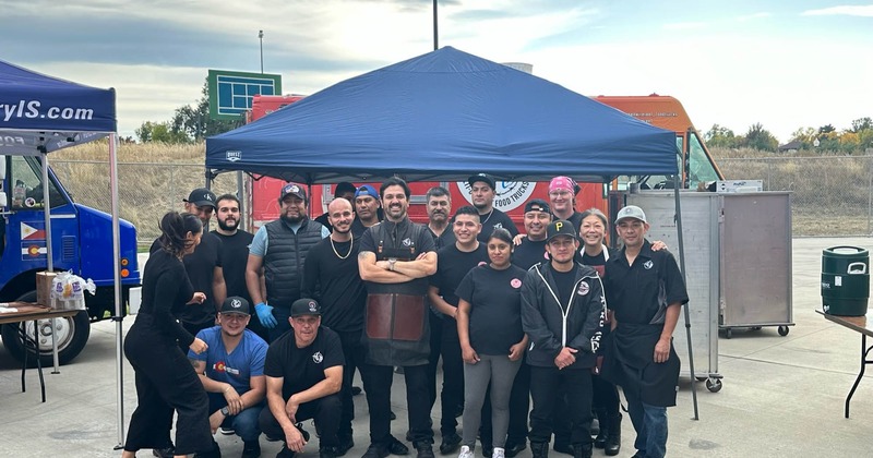 The entire staff posing together outside