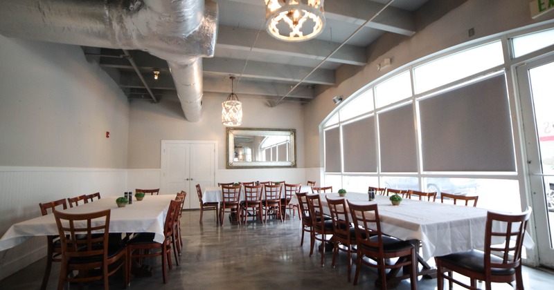 Interior, tables and chairs ready for guests