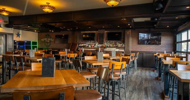 Interior, seating space with wooden tables and chairs