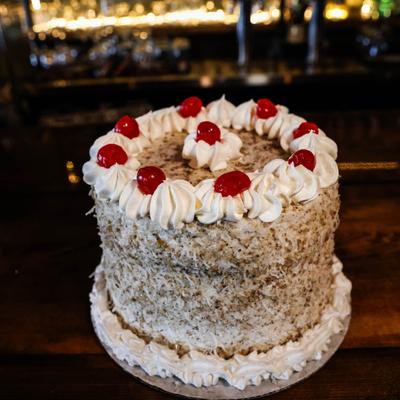 Italian Cream cake, with vanilla, walnuts, pecans, and coconut buttercream.