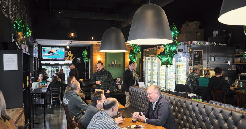 Restaurant interior, lots of guests talking to each other, cozy atmosphere