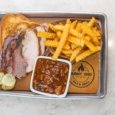 Smoked turkey, brisket, beans, fries, and toast.