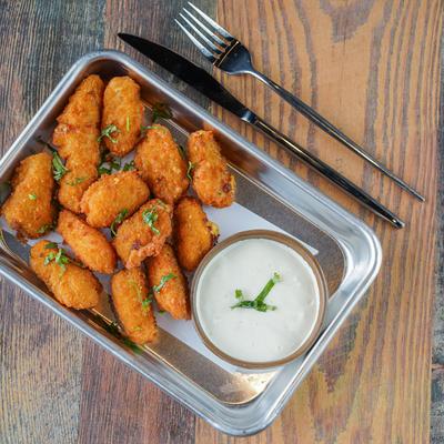 Jalapeno Cheese Bites served with lemon garlic aioli, top down view.