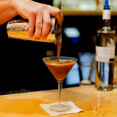 Bartender pouring an Espresso Martini.