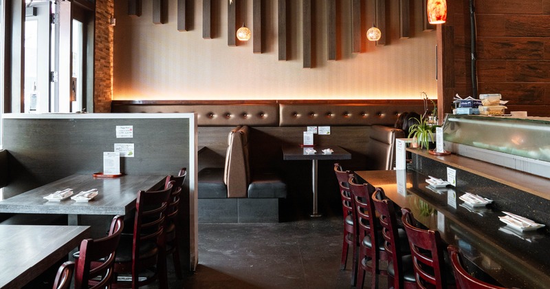 Cozy interior dining area of a Japanese sushi restaurant
