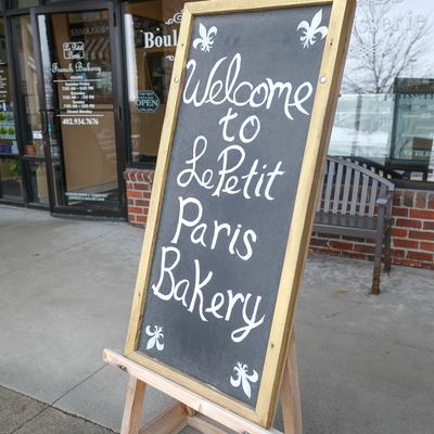 Welcome chalkboard sign in front of the bakery.