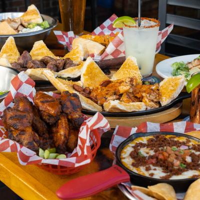 Various menu items served on the table with drinks.