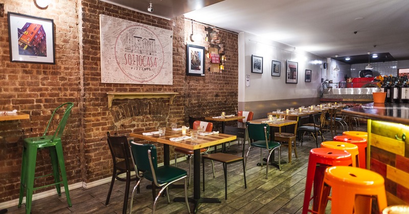 Interior, dining tables with tableware ready for guests