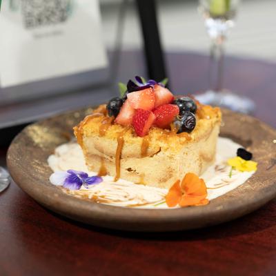 Bread Pudding topped with berries.