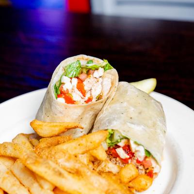 Italiano grilled chicken wrap with fries.