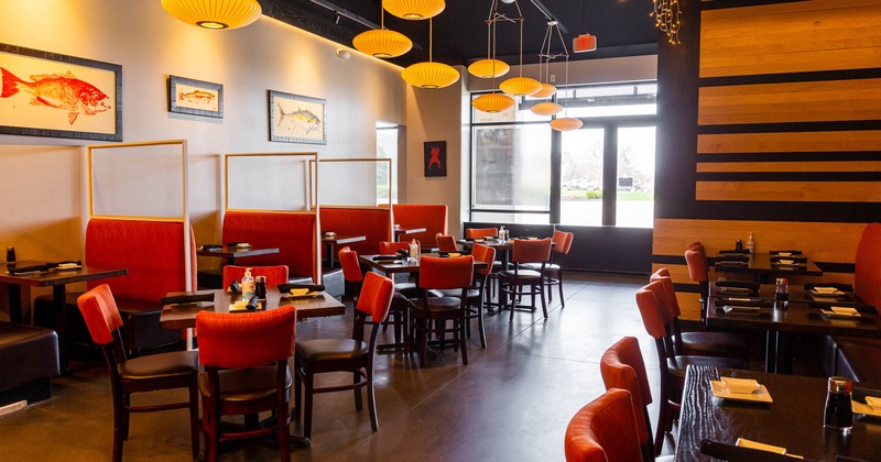 Dining area with tables and orange chairs