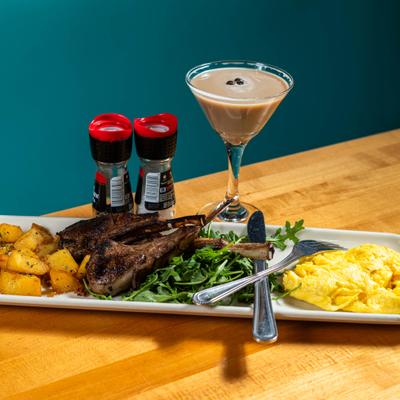Lamb chops with potatoes, greens,  potatoes and an espresso martini cocktail.