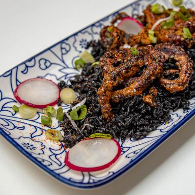 Grilled octopus, togarashi sauce, black squid ink rice.