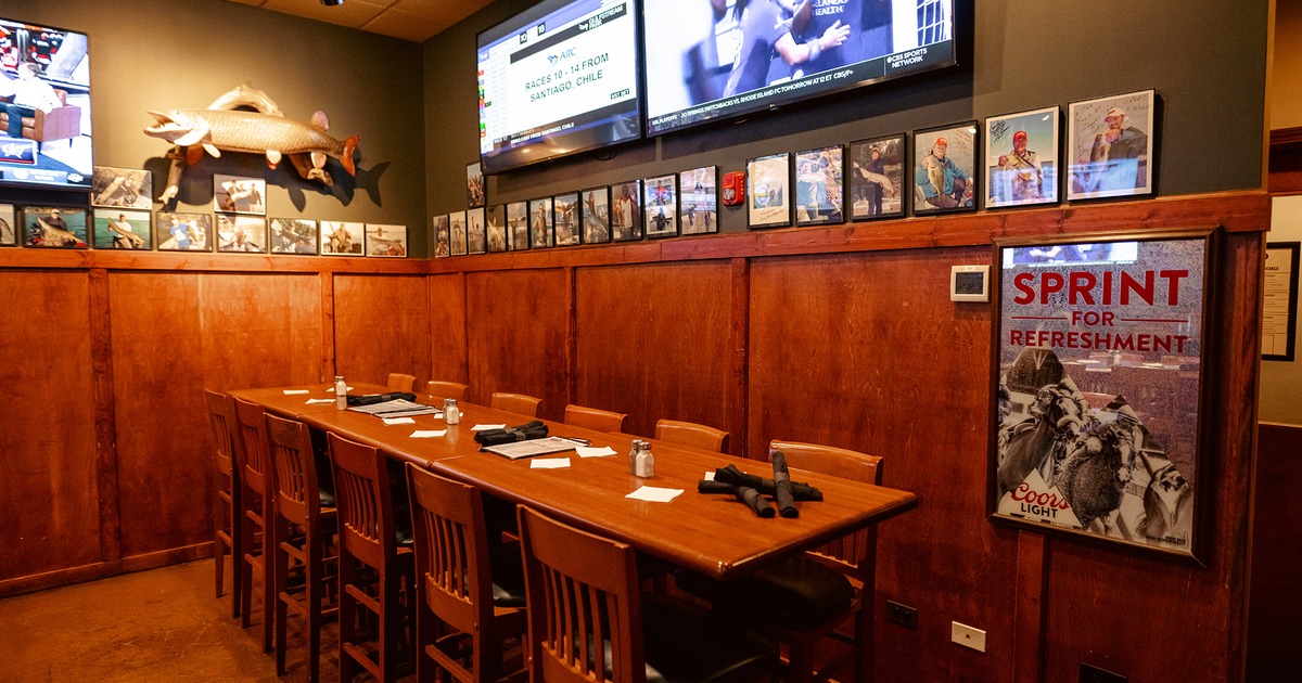 The dining table in the corner ready for twelve guests