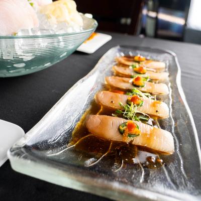 Yellowtail filets with jalapenos, angled view.