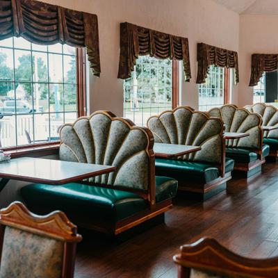 Seating booths by the windows.