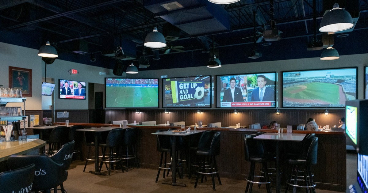 Interior, seating area with multiple TV screens