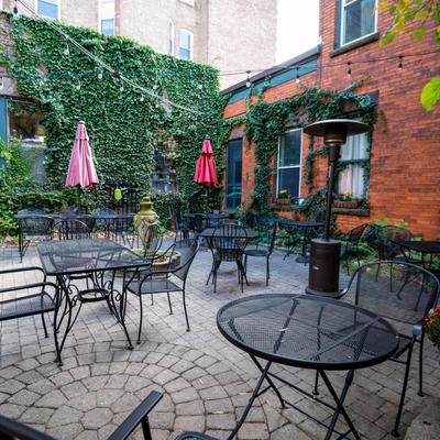Outdoor seating area, tables and chairs.