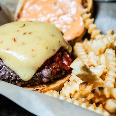 Southwest burger served with fries.