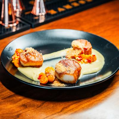 Scallops in citrus beurre blanc sauce.