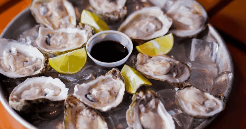 A platter of raw oysters on the half shell