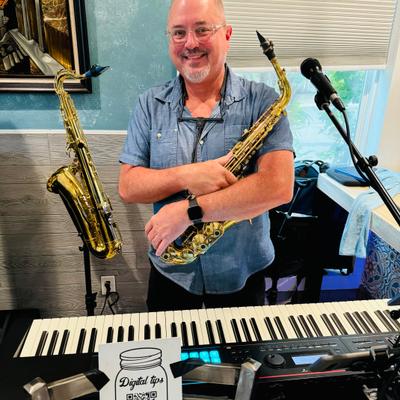 A musician holding a saxophone.