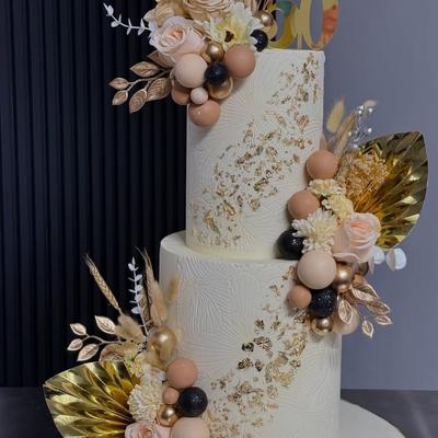Two tiered cake with decorations.