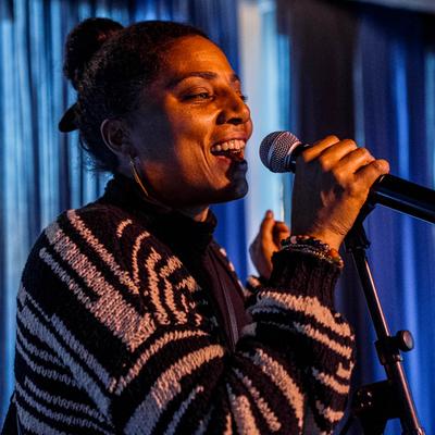 A singer performing on a stage inside