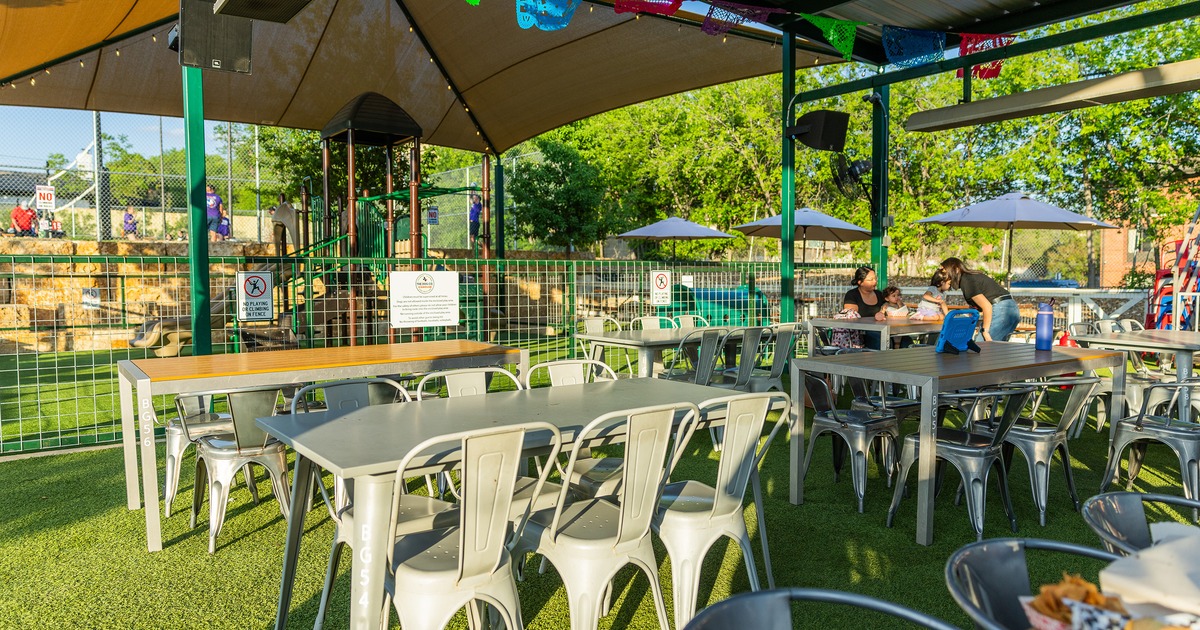Relaxed outdoor seating area with metal tables and chairs