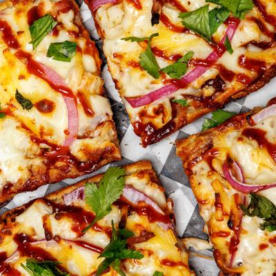 BBQ Chicken pizza on Italian bread, close-up.