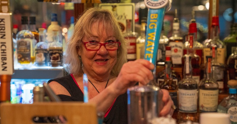 Bartender pouring a beer from the tap