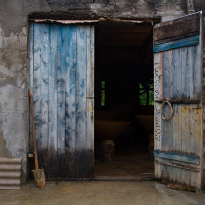Blue doors to Zaliko's qvevri-making studio - clay shovel