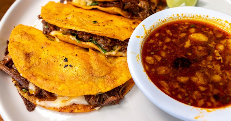 Birria tacos with broth