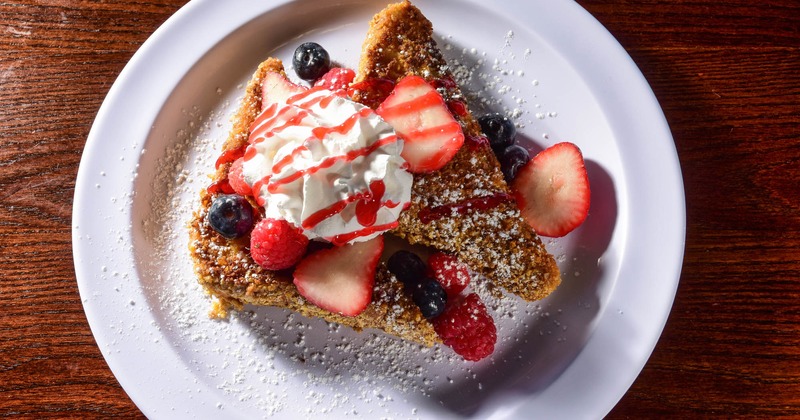 French toast topped with berries and whipped cream