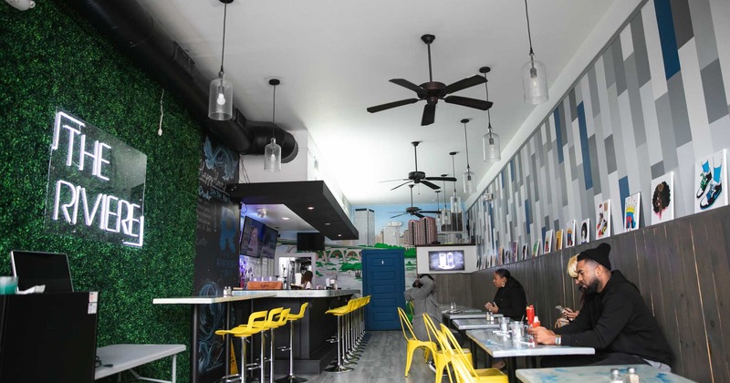 Dining room, green wall, tables, people eating