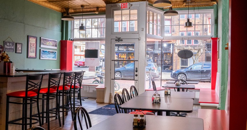 Interior, seating area with a bar on the left
