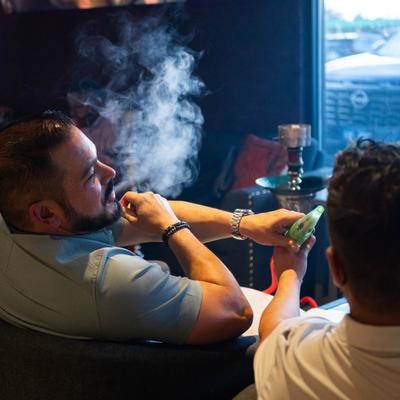 Guests smoking a hookah.