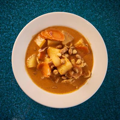 Massaman curry with carrot, potatoes, roasted peanuts and onions.