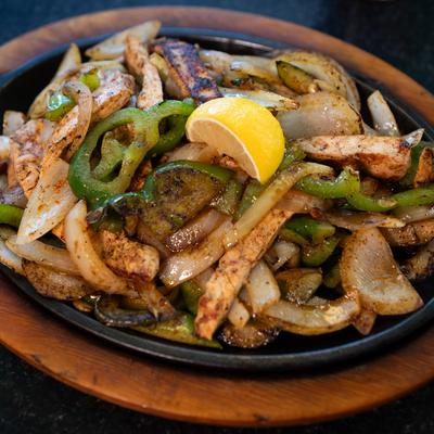 Chicken Fajitas, with sauteed onions, bell peppers, and zucchini.