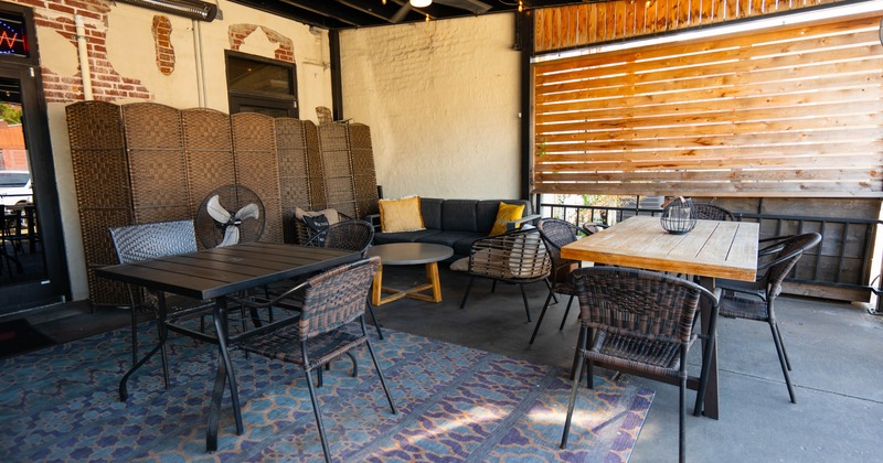 Covered patio with chairs and tables