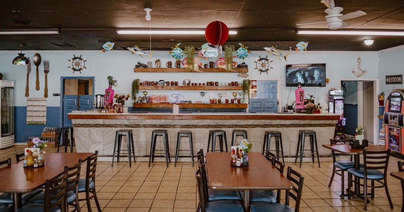 Interior, seating area with a bar in the back