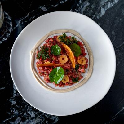 Steak Tartare, with Filet Mignon, cashew cream, and garlic chips.