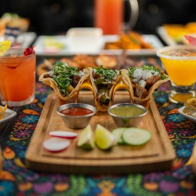 Tacos, with onion, cilantro, and salsa.