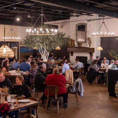 Dining area with people sitting at tables.