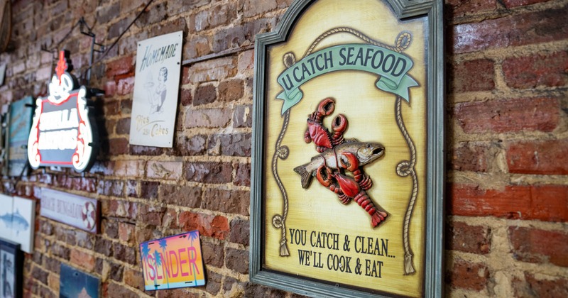 U Catch Seafood wall sign featuring fish and lobster design