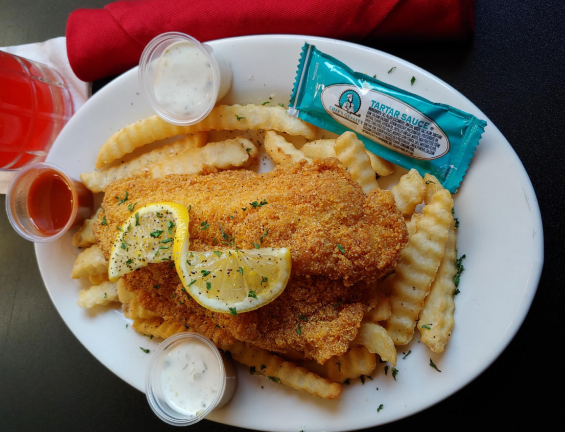 Fried catfish with crinkle-cut fries and tartare sauce on the side