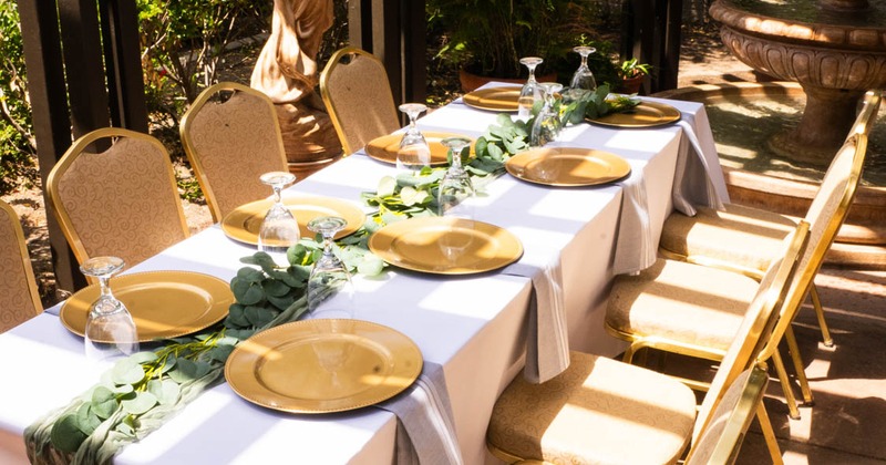 Exterior, table with tableware and chairs ready for guests