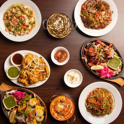 A colorful selection of Indian dishes on a table.